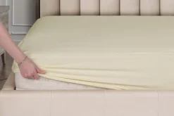 Elastyczne, kolorowe prześcieradło Klinmam Home Jersey, kolor kremowy, 100x200 cm